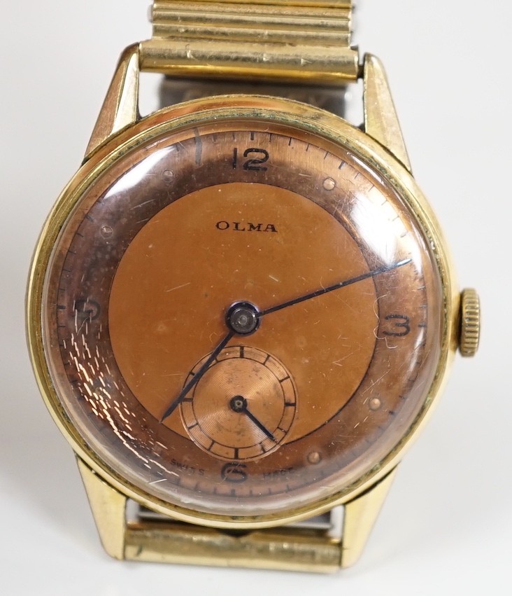 A gentleman's gold plated Olma manual wind wrist watch, case diameter 32mm, on associated flexible bracelet.